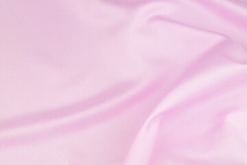 Pink satin or silk fabric background.	