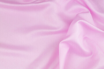 Pink satin or silk fabric background.	