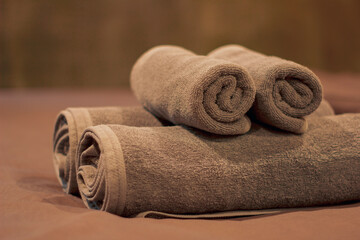 brown soft towel The rolls are arranged beautifully in the room. For use in bedrooms, bathrooms, spas.