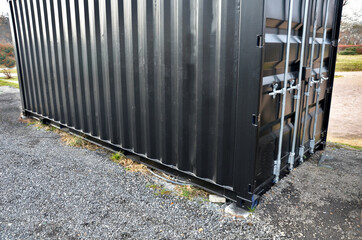 The black shipping container serves as a folded material. if refrigeration is supplied, it is a...