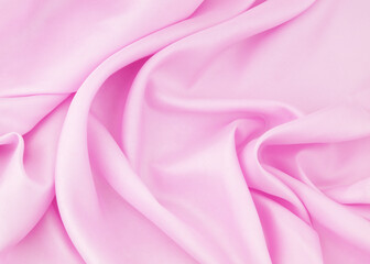 Pink satin or silk fabric background.