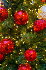 Holiday decorations for the Christmas tree. Blurred holiday background.