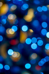 Obraz premium Beautiful bokeh effect. Blurred bright festive Christmas background.