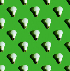 Lighting lamps seamless pattern. Background on the theme of light bulbs.