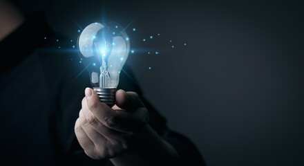 New ideas, inspiration and innovation concept. businessman holding a light bulb 