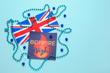 Fototapeta premium Greeting card with text BONFIRE NIGHT, flag of Great Britain and beads on color background