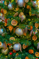 Holiday decorations for the Christmas tree. Blurred holiday background.