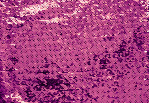 Luxury texture made of violet sequins. Shiny colors 2022