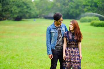 Portrait asia young couple in love, boyfriend and girlfriend happy in park