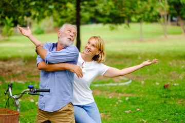 Fototapeta premium Portrait caucasian senior woman and old man, couple elder in love happy in park