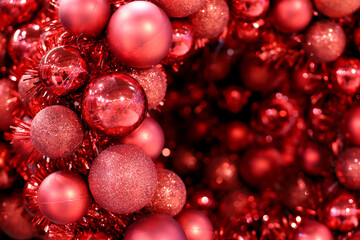 Christmas decorations for background. Red toy balls and tinsel for New Year celebration