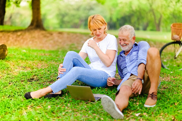 Fototapeta premium Portrait caucasian senior woman and old man, couple elder in love happy in park