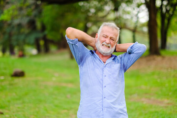 caucasian old man in park, He have pains and aches after exercise