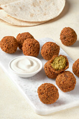 Chickpeas falafel with tahini sauce. Closeup  , selective focus