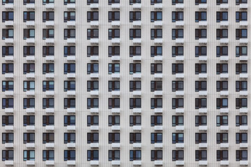 Background image - a wall of a multi-storey building with the same windows