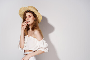 woman wearing hat cosmetics posing fashion light background