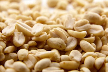 Raw blanched peanuts as food background