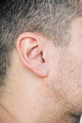 Naklejka premium Closeup of white man's ear