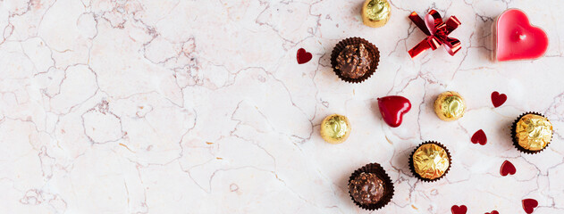 Chocolates on a marble texture background
