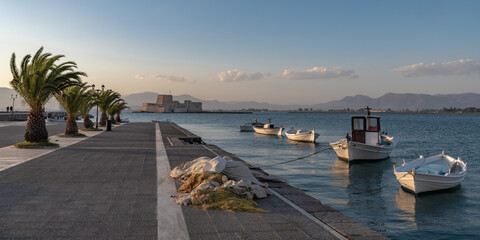 Fishing boats on the evening embankment