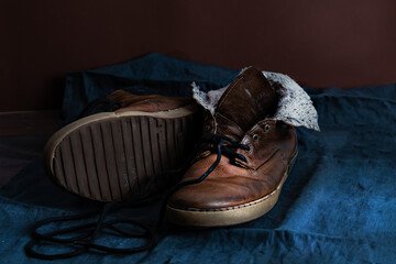Vintage men's boots on a dark blue background. Retro
