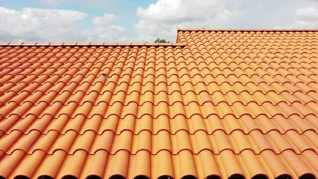 Clay tile roof on a house under construction.
