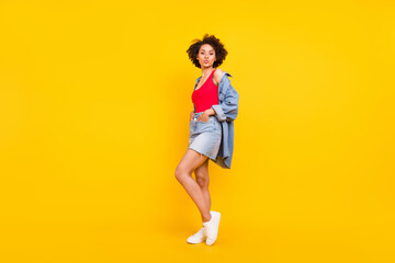 Fototapeta na wymiar Full body photo of cute charming afro american woman send air kiss enjoy isolated on yellow color background