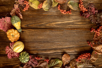 Autumn layout composition frame of dry leaves, branch, yellow green pumpkins and berries on white background, Flat lay, top view, copy space, fall ... 