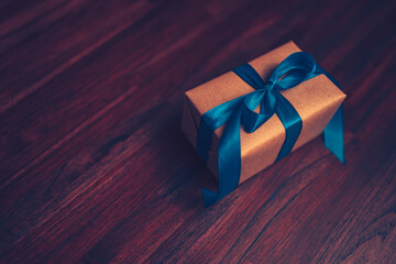 gift box, present on the table and light of bokeh background. Valentine's Day, Christmas, Birth day, New year and Anniversary concept.