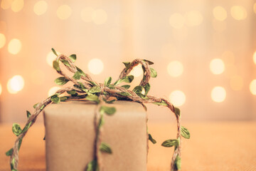 gift box, present on the table and light of bokeh background. Valentine's Day, Christmas, Birth day, New year and Anniversary concept.