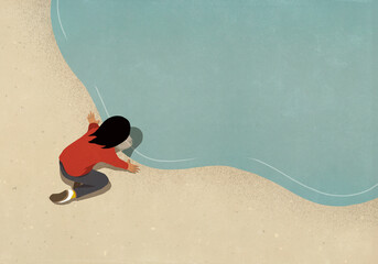 Woman looking at reflection in water surface
