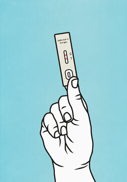Hand holding rapid Covid Antigen test
