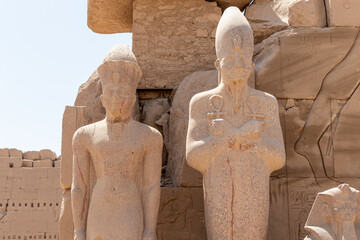 Statues of pharaohs at the temple of Karnak in Luxor, old Egypt.