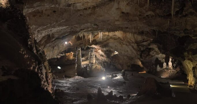 Beautiful shots of karst cave, Lipa Cave situated Serbia, East Europe. Illuminated dark cave with stalactites and stalagmites. Unique nature landscape. High quality 4k footage