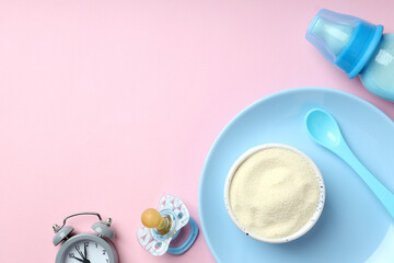 Concept of baby food with рowdered milk on pink background