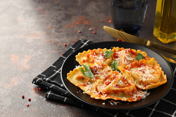 Delicious food concept with ravioli on textured background