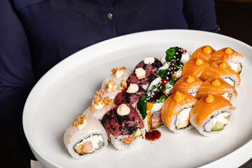 tasty sushi with fresh fish and vegetables