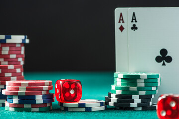 Poker Chips, Dices and Aces Cards on Casino Table. Gambling Background