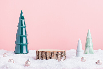 Christmas holiday wooden podium or stand in snow with ceramic Christmas trees
