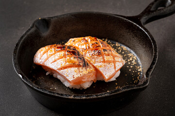 nigiri with salmon in the pan