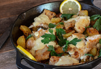 Fish pan with potatoes and bechamel sauce