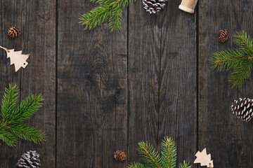 Christmas greeting card background with Christmas decorations on dark wooden table. Top view, flat lay composition