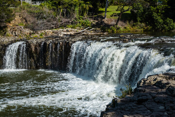 Fototapeta premium Spectacular view over Haruru Falls on a summer afternoon. Paihia, New Zealand