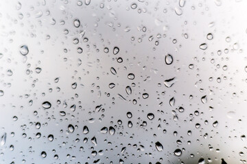 Rain drops on window glass outside texture background water