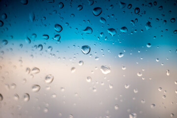 Rain drops on window glass outside texture background water