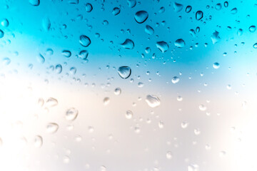 Rain drops on window glass outside texture background water