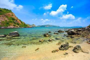 Tropical island rock on the beach with blue sky. Koh kham pattaya thailand 
