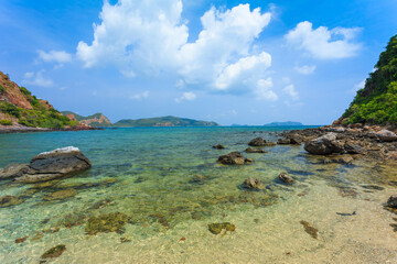 Fototapeta na wymiar Tropical island rock on the beach with blue sky. Koh kham pattaya thailand 