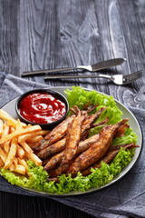 crispy fried capelin with lettuce, french fries