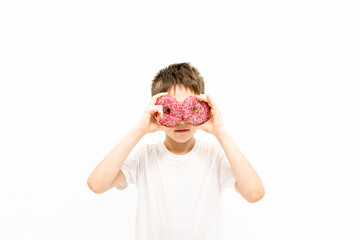 portrait of a boy with a donut on his face